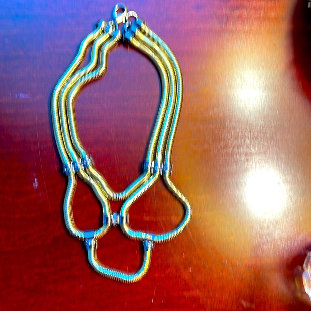 Women’s vintage goldtone three strand fashion statement necklace. Pre-owned.